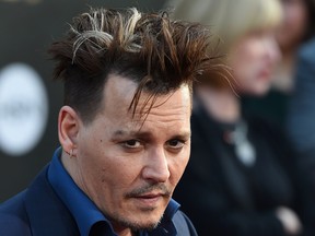 Actor Johnny Depp attends the premiere of Disney's 'Alice Through The Looking Glass,' May 23, 2016 at the El Capitan Theatre in Hollywood, California. Depp has been caset in the Fantastic Beasts and Where to Find Them sequel, which was met with little fanfare online. (ROBYN BECK/AFP/Getty Images)