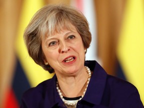 Britain's Prime Minister Theresa May speaks during a press statement with Colombia's President Juan Manuel Santos at 10 Downing Street in London, Wednesday, Nov. 2, 2016. This year's Nobel Peace Prize laureate the President of Colombia Juan Manuel Santos and his wife Maria Clemencia Rodriguez are on a three day state visit to Britain. (AP Photo/Kirsty Wigglesworth, pool)