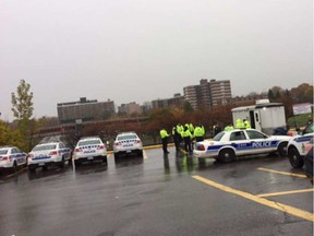 Police assemble for a morning briefing at Lincoln Fields on Thursday in the search for an 86-year-old woman with 'advanced dementia.' Tom Spears TOM SPEARS / POSTMEDIA