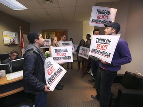 In the wake of the arrest of nearly 100 climate activists in Ottawa, and to Enbridge's use of violent private security contractors, and dog attacks, against pipeline protestors in Standing Rock, a group of people are staging a sit-in protest at Jim Carr's constituency office. (CHRIS PROCAYLO/WINNIPEG SUN)