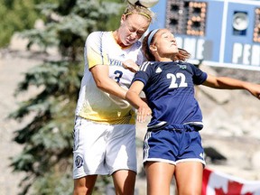Allison Pilon of the Laurentian Voyageurs womens soccer team battles to head the ball with Julia  Previte of the Nipissing Lakers soccer team during OUA soccer action from Laurentian Field in Sudbury, Ont. on Sunday September 11, 2016. Pilon was named the winner of the OUA East Division Community Service Award this week for her work with Free the Children. Gino Donato/Sudbury Star/Postmedia Network