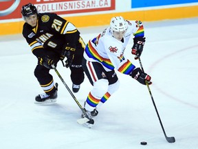 Sarnia Sting defenceman Kelton Hatcher, pictured earlier this season battling for the puck against Danial Singer of the Niagara IceDogs, is settling into his rookie Ontario Hockey League season. The 17-year-old New Jersey native, a fourth-round 2015 draft pick, has five assists through his first 16 OHL games while playing primarily in a defensive role with partner Connor Schlichting. (Sarnia Observer file photo)
