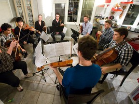 Artistic director Annette-Barbara Vogel, left, leads the Magisterra Soloists as they rehearse Tico-Tico, a piece of renowned Brazilian music they?ll perform at a fundraiser Saturday at the Hassan Law Community Gallery. (CRAIG GLOVER, The London Free Press)