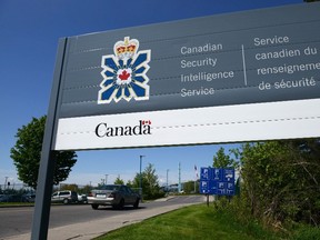 A sign for the Canadian Security Intelligence Service building is shown in Ottawa, Tuesday, May 14, 2013. A Federal Court judge says Canada's spy agency illegally kept potentially revealing electronic data about people over a 10-year period. THE CANADIAN PRESS/Sean Kilpatrick