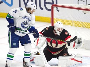 Vancouver Canucks left winger Loui Eriksson pressures Ottawa Senators goalie Mike Condon as he tries to make a save during third period NHL action in Ottawa on Nov. 3, 2016. (THE CANADIAN PRESS/Adrian Wyld)