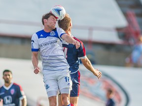 FC Edmonton captain  Daryl Fordyce goes up for the ball against and Indy Eleven Player during teh teams' first meeting in Indianapolis in July.  (Trevor Ruszkowski, Indy Eleven)