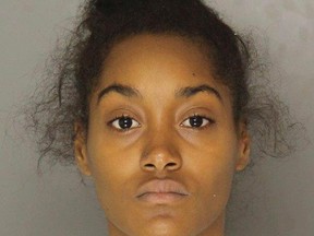 This Wednesday, Nov. 2, 2016, booking photo provided by the Allegheny County Police Department shows Christian Clark, of McKeesport, Pa. Police say Clark, charged with criminal homicide in the death of her 17-month-old son Andre Price III, sent a video of the boy's apparently lifeless body to his father in a jealous, vengeful rage during a text-messaged argument that lasted more than two hours. (Allegheny County Police Department via AP)