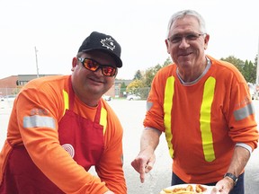 Cam Major and Gary Jordan from Hydro One participate in the Hydro One Lambton Operations Centre United Way of Sarnia-Lambton Kickoff Fish Fry. Employees at the Wyoming office thought a Fish Fry would be a nice alternative to chili this year. The United Way is now at 68 per cent of its $2-million goal. (United Way photo)
