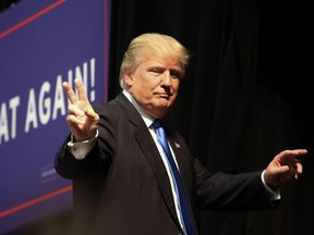 Republican presidential nominee Donald Trump gestures after speaking at a campaign rally inside the Cabarrus Arena 7 Events Center in Concord, North Carolina on November 3, 2016. (LOGAN CYRUS/AFP/Getty Images)