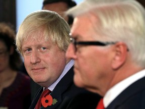 German Foreign Minister Frank-Walter Steinmeier, right, and his counterpart from Great Britain, Boris Johnson, left, attend a joint press conference at the foreign ministry in Berlin, Germany, Friday, Nov. 4, 2016. (AP Photo/Michael Sohn)