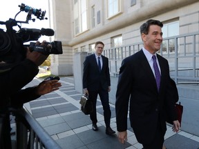 Bill Baroni, right, New Jersey Gov. Chris Christie's former top appointee at the Port Authority of New York and New Jersey, arrives at Martin Luther King, Jr., Federal Court, Friday, Nov. 4, 2016, in Newark, N.J. Baroni and Bridget Kelly are charged with scheming to use traffic jams to punish a Democratic mayor who didn't endorse Christie in 2013. (AP Photo/Julio Cortez)