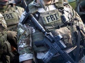 Members of a Federal Bureau of Investigation SWAT team are seen during an FBI field training exercise at the Landmark Mall in Alexandria, Va., on May 2, 2014. (BRENDAN SMIALOWSKI/AFP/Getty Images)