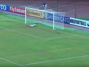 Jang Paek Ho dives for the ball as it crosses the goal line during the Asian Under-16 Championship match against Uzbekistan in September. (YouTube screengrab)