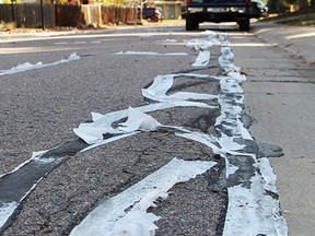 Crews have used bathroom tissue to help seal up cracks along more than 120 streets. (City of Littleton photo)