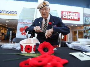 Jason Miller/The Intelligencer
Bob Mitchell, a Second World War naval veteran, was one of the volunteers manning the Quinte Mall Poppy Fund booth Friday.