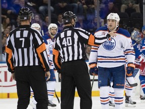 Edmonton Oilers left wing Milan Lucic (27) argues with officials Steve Kozari (40) and Lauren Holtkamp (7) after a goal was disallowed during the second period of the Oilers' NHL hockey game against New York Rangers, Thursday, Nov. 3, 2016, at Madison Square Garden in New York. (AP Photo/Mary Altaffer)