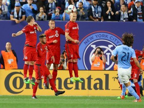 TFC’s Michael Bradley defends a free kick by NYCFC’s Andrea Pirlo when the teams met earlier this season at Yankee Stadium. (GETTY IMAGES)