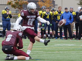 Frontenac Falcons' Braeden North kicks the ball, held by quarterback Brendan Steele, for a field goal during the end of the second quarter of the Kingston Area Secondary Schools Athletic Association senior football semifinal game at CaraCo Home Field, in Kingston, Ont., on Tuesday, November 1, 2016. With a score of 36-16 the Falcons will move on to face La Salle Black Knights in the KASSAA championship game held at Richardson Stadium on Saturday. Julia McKay/The Whig-Standard/Postmedia Network