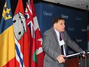 Queen's University principal Daniel Woolf speaks during the annual principal's community breakfast in Kingston on Friday. He stressed the need for continued focus on innovative research. (Michael Lea/The Whig-Standard)
