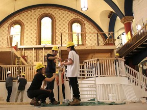 Construction continues inside Grant Hall at Queen's University, in Kingston on Thursday, on the set for the annual Science Formal. Fourth-year engineering students have spent a year designing and building the structures for the theme The Golden Age of Film. (Michael Lea/The Whig-Standard)