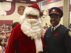 Chief Mark Saunders and Santa Claus kick off the 23rd annual Toronto Police Auxiliary Toy Drive at Maurice Cody Junior Public School on Friday, Nov. 4, 2016. CHRIS DOUCETTE/TORONTO SUN
