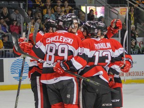Ottawa 67's players celebrate with teammate Drake Rymsha after he scored the first goal of the game during the first period of Ontario Hockey League action at the Rogers K-Rock Centre in Kingston on Friday night. (JULIA MCKAY/The Whig-Standard)