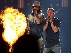 Tyler Hubbard (left) and Brian Kelley of Florida Georgia Line perform on its Dig Your Roots tour at MTS Centre in Winnipeg on Fri., Nov. 4, 2016. Kevin King/Winnipeg Sun/Postmedia Network