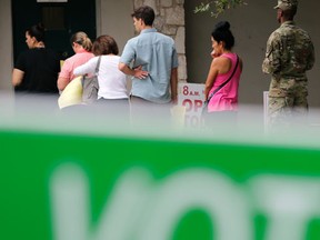 In this Nov. 4, 2016, photo, voters wait in line to cast ballots at an early polling site in San Antonio. Your parents were right: Math really does matter. After all of the tumult and tedium of a long, ugly presidential campaign, Election Day is all about which candidate can win enough states to get to 270 electoral votes. (AP Photo/Eric Gay)