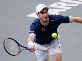 Britain's Andy Murray returns the ball to Tomas Berdych of Czech Republic during the quarterfinal match of the Paris Masters tennis tournament at the Bercy Arena, in Paris, Friday, Nov. 4, 2016.