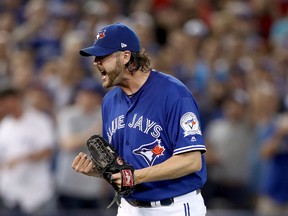 Jason Grilli of the Toronto Blue Jays reacts after closing out the top of the eighth inning against the Cleveland Indians during game four of the ALCS at Rogers Centre on October 18, 2016 in Toronto. (Elsa/Getty Images)