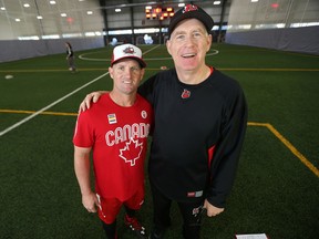 Toronto Blue Jays minor league system hitting coach, Stubby Clapp (left), and University of Winnipeg baseball head coach, Morgan de Pena, at the University of Winnipeg.