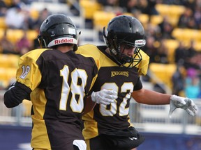 La Salle Black Knights Tyrus Bromley and Grant LeGood celebrate after their team's first touchdown during the Kingston Area Secondary Schools Athletic Association senior football final at Richardson Stadium in Kingston, Ont., on Saturday November 5, 2016. La Salle beat the Frontenac Falcons, 30-28. Steph Crosier/Kingston Whig-Standard/Postmedia Network