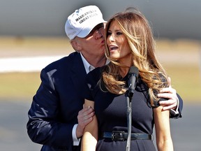 Republican presidential candidate Donald Trump kisses his wife Melania as she introduces him at a campaign rally Saturday, Nov. 5, 2016, in Wilmington, N.C. (AP Photo/John Bazemore)