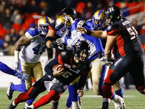 Ottawa Redblacks quarterback Danny O'Brien runs the ball for a first down against the Winnipeg Blue Bombers during CFL action at TD Place in Ottawa on Nov. 4, 2016. (Errol McGihon/Postmedia)