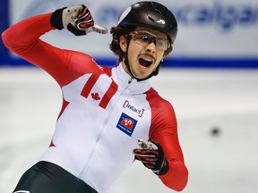 Canada's Samuel Girard celebrates his victory in the men's 500m final at the ISU World Cup short track speed skating event in Calgary on Nov. 5, 2016. (THE CANADIAN PRESS/Jeff McIntosh)