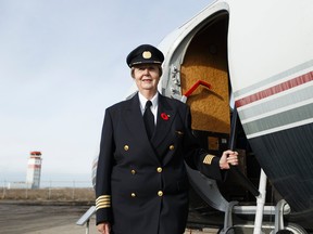 Canadian aviation trailblazer Capt. Rosella Bjornson poses for a photo after a ceremony at the Alberta Aviation Museum in her honour in Edmonton, Alberta on Saturday, November 5, 2016. Bjornson is Canada's first female airline captain. Ian Kucerak / Postmedia