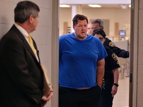 Todd Kohlhepp is escorted into a Spartanburg County magistrate courtroom, Friday, Nov. 4, 2016, in Spartanburg, S.C.. Kohlhepp, a 45-year-old registered sex offender with a previous kidnapping conviction, appeared at a bond hearing Friday on a kidnapping charge in connection to a woman being found chained inside a storage container on a property in Woodruff, S.C. More charges will be filed later, the prosecutor told the court.
(Tim Kimzey/The Spartanburg Herald-Journal via AP)