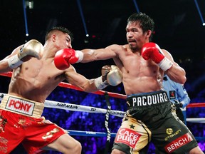 Jessie Vargas, left, fights Manny Pacquiao, of the Philippines, during their WBO welterweight title boxing match, Saturday, Nov. 5, 2016, in Las Vegas. (AP Photo/Isaac Brekken)