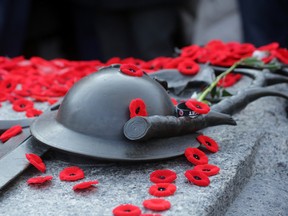 Poppies sit on the Tomb of the Unknown Soldier after this morning's Remembrance Day ceremony, November 11, 2014 in Ottawa, Canada. (Photo by Mike Carroccetto / Getty Images)