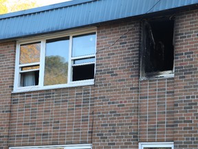 A burnt out window on the second-floor of a Turnbull Street apartment complex points to the origin of a fire that has displaced 37 residents since Friday.