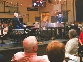 Burn ’N’ Mahn dueling pianists Brian Burns (right) and Jamie Mahn entertained the audience for the Fall Harvest Celebration Saturday evening at the Cultural-Recreational Centre.