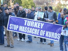 Members of the local Kurdish community demonstrate opposition to Turkey's treatment of Kurds at a protest in Winnipeg, Man. Sunday, Nov. 6, 2016. (Brian Donogh/Winnipeg Sun/Postmedia Network)
