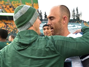 Eskimos head coach Jason Maas, without his game mic, greets Ricky Ray after Saturday's game at Commonwealth Stadium. (Ed Kaiser)