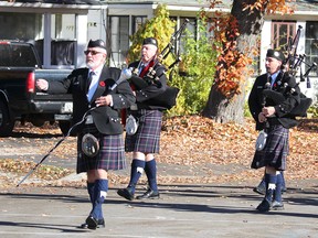 Point Edward's Remembrance Day service began Sunday with a march to the village cenotaph led by the Sarnia Legion Pipe Band. (Neil Bowen/Sarnia Observer)