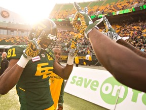 Conversation in the Eskimos lounge during Saturday's game - here, Devon Bailey celebrates a touchdown against he Argos - reinforced John Short's impression of the positives gained from supporting sports. (The Canadian Press)