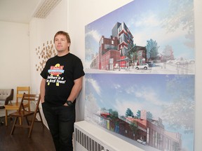 Greg Oldenburg, of the Brewer Lofts, stands next to concept drawing for the project. (John Lappa/Sudbury Star)