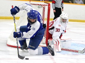 Gino Donato/Sudbury Star
Sudbury Wolves player Joe Mazur tries to redirect the puck in front of Toronto Nationals goalie Jack Watson during midget championship game action at the Big Nickel hockey tournament on Sunday afternoon.