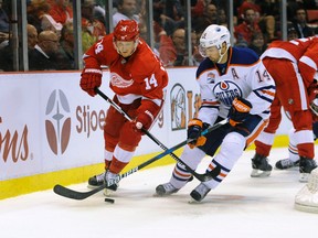 Detroit Red Wings right wing Gustav Nyquist of Sweden skates against Edmonton Oilers' Jordan Eberle. (AP Photo)