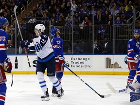 Winnipeg Jets right wing Patrik Laine (29) celebrates after scoring a goal past New York Rangers goalie Henrik Lundqvist (30) in the first period of an NHL hockey game, Sunday, Nov. 6, 2016, in New York. (AP Photo/Adam Hunger)