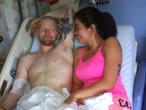 Fort McMurray firefighter Bo Cooper and his wife Irish, shown in the hospital, in this photo from Facebook.